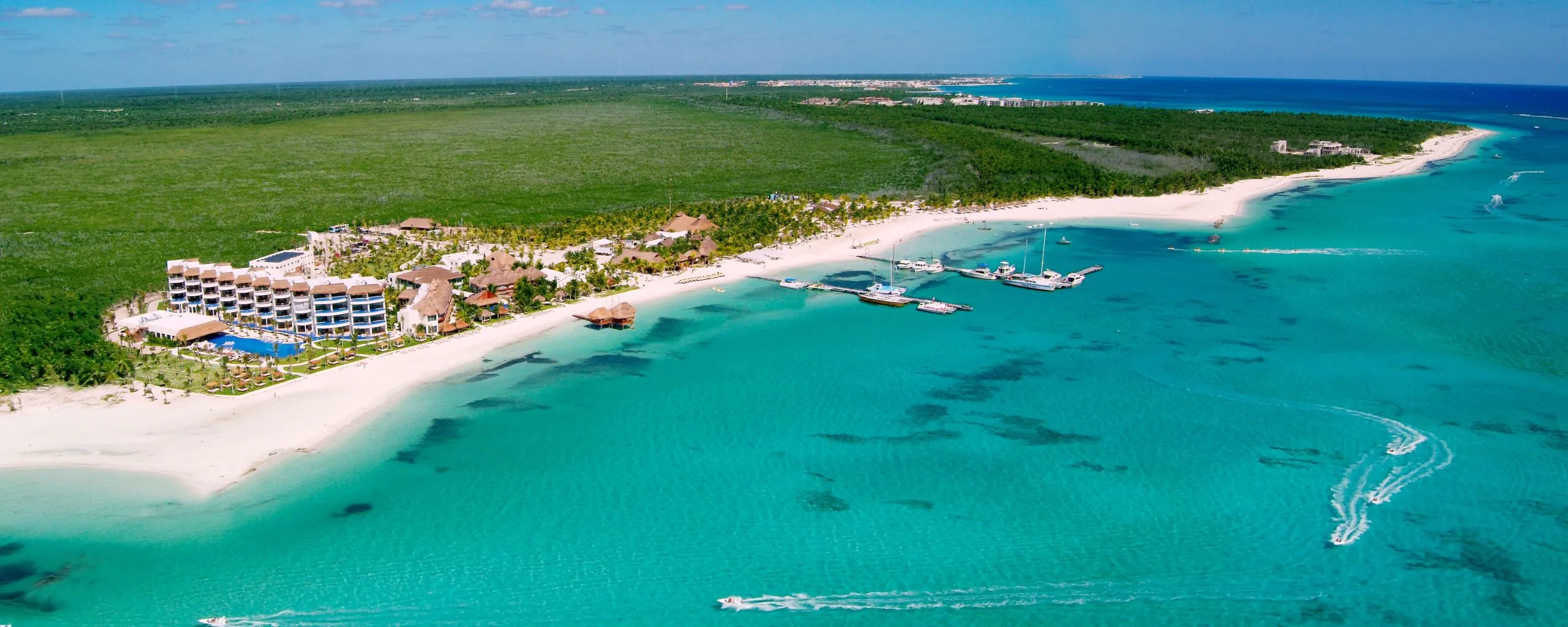 Aerial view of a beachfront resort and white-sand coast on Mexico's Riviera Maya