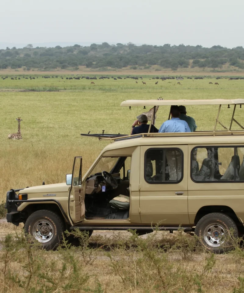 Safari vehicle on the plains of Akagera National Park, Rwanda