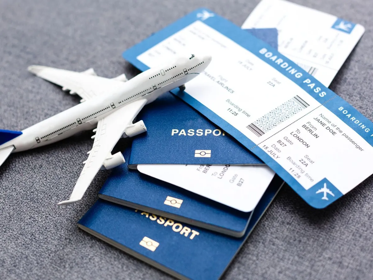 Passports, boarding passes and a model aeroplane
